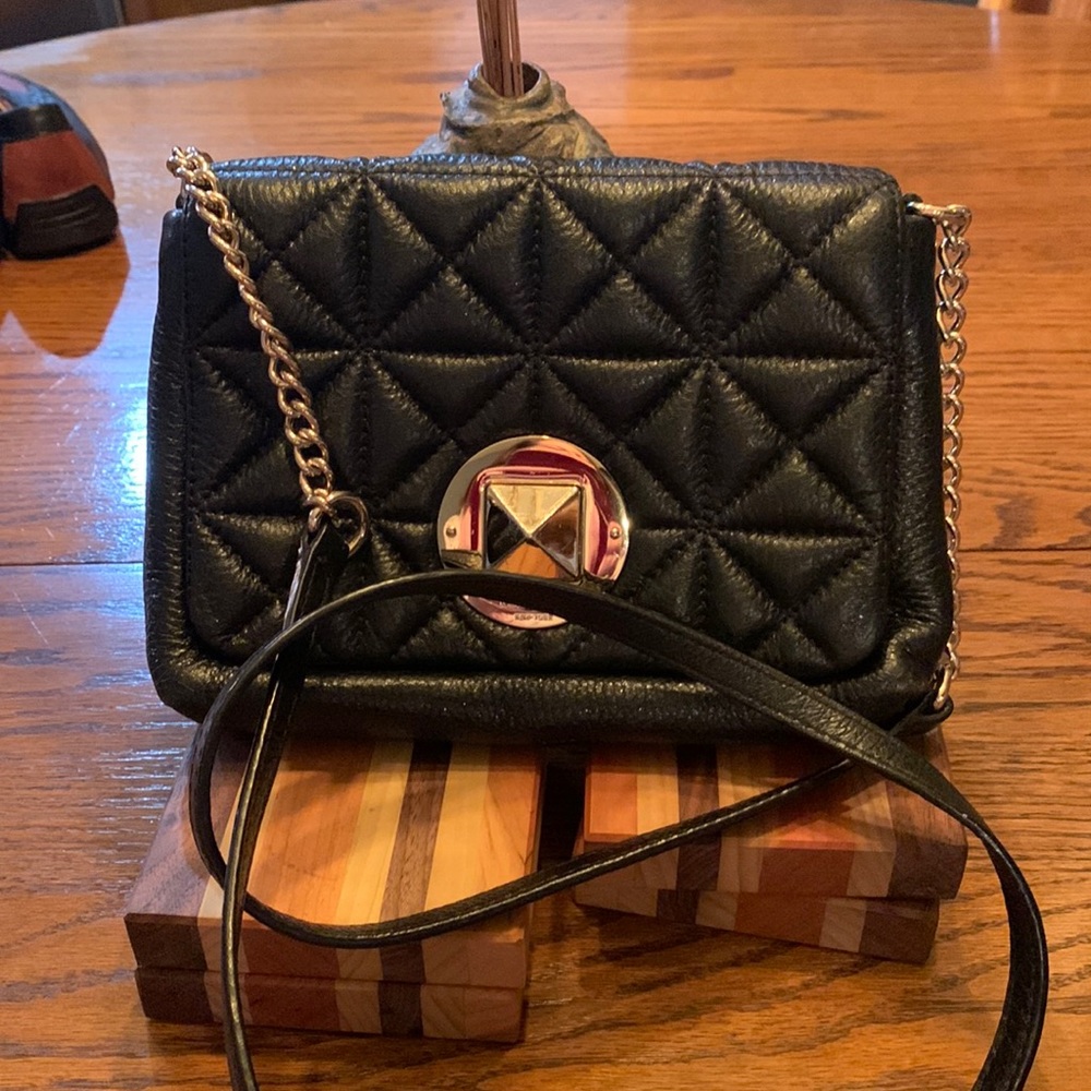 Black quilted Kate Spade crossbody. Good used condition.